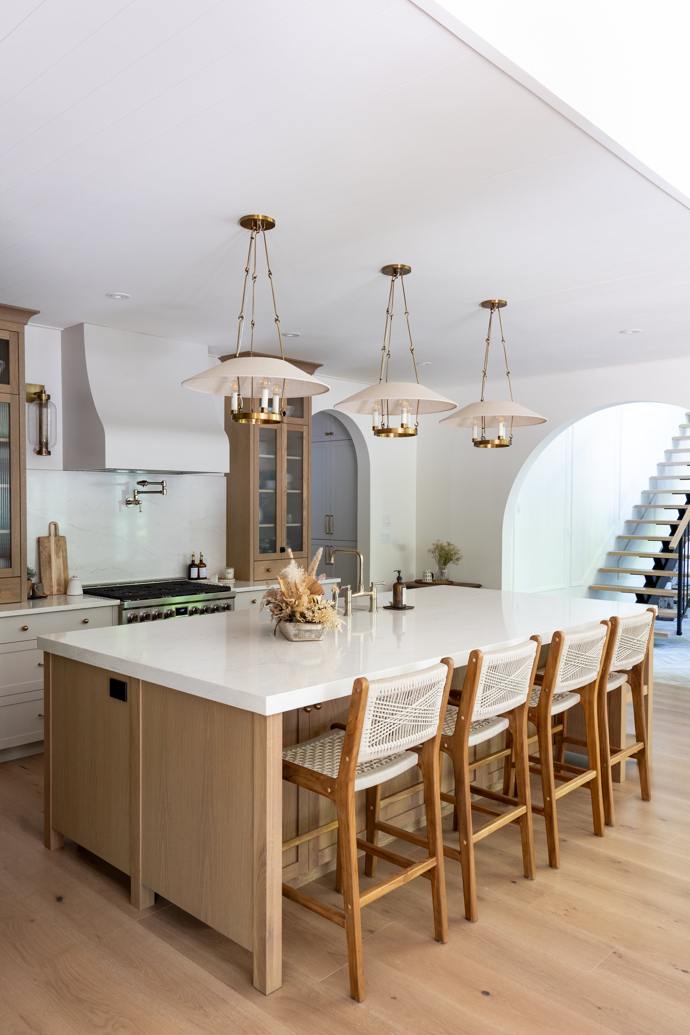 Modern kitchen with a island and wooden bar stools.