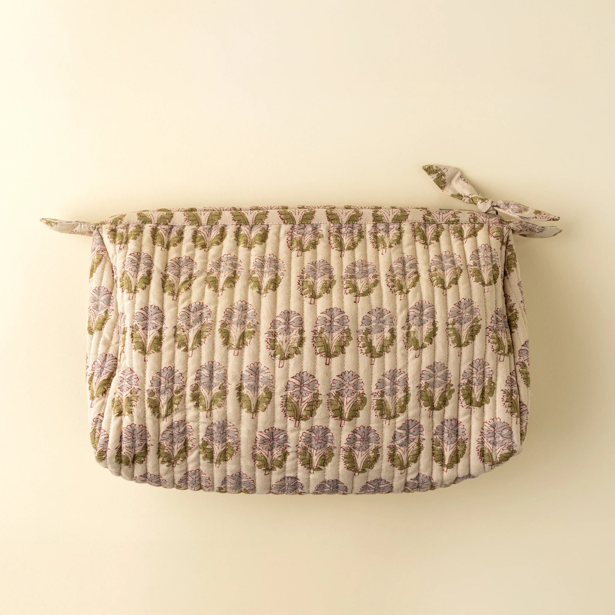 Floral patterned wall hanging on a beige background